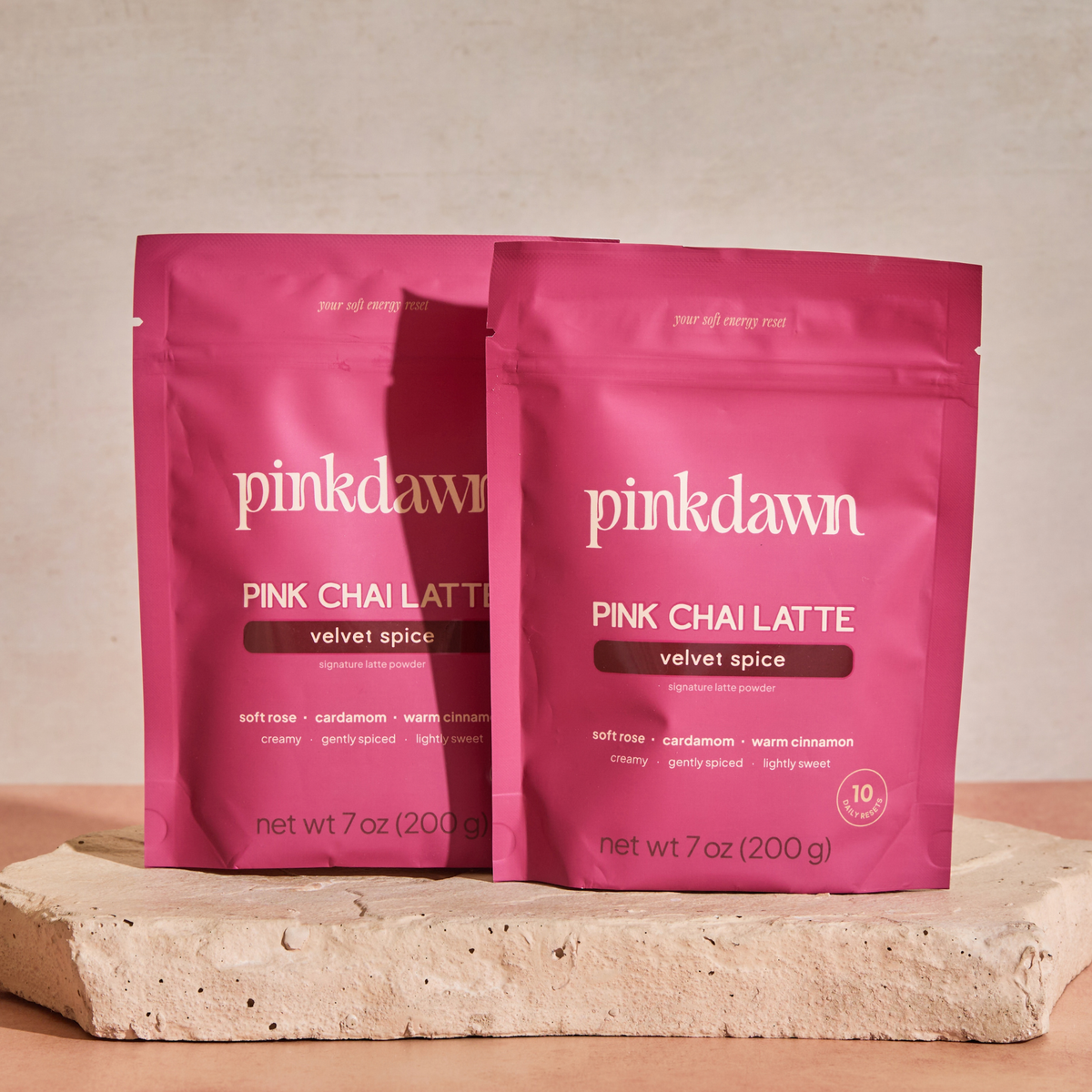 Two PinkDawn Velvet Spice Pink Chai Latte pouches, 20 servings.